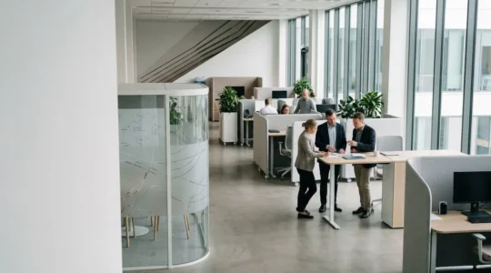 Modern office workspace showing strategic organizational transformation